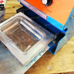 Máy dán ép dập đậy đóng nắp miệng hộp Eton An Việt